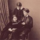 Three children with a book